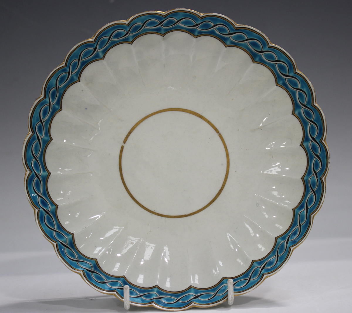 A Worcester porcelain turquoise glazed trio, circa 1770, painted