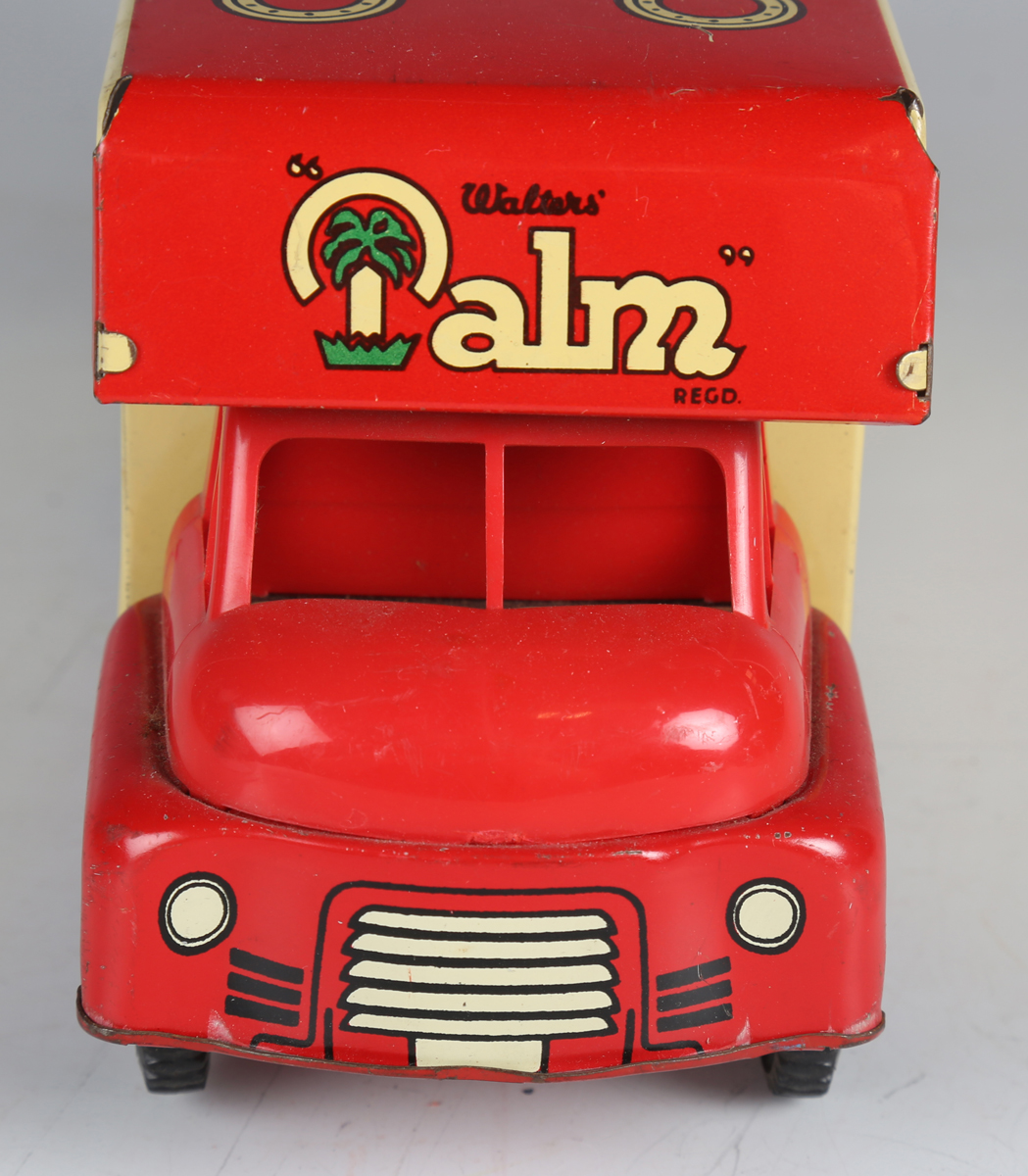 A Wells Brimtoy tinplate clockwork Walters' Palm Toffee