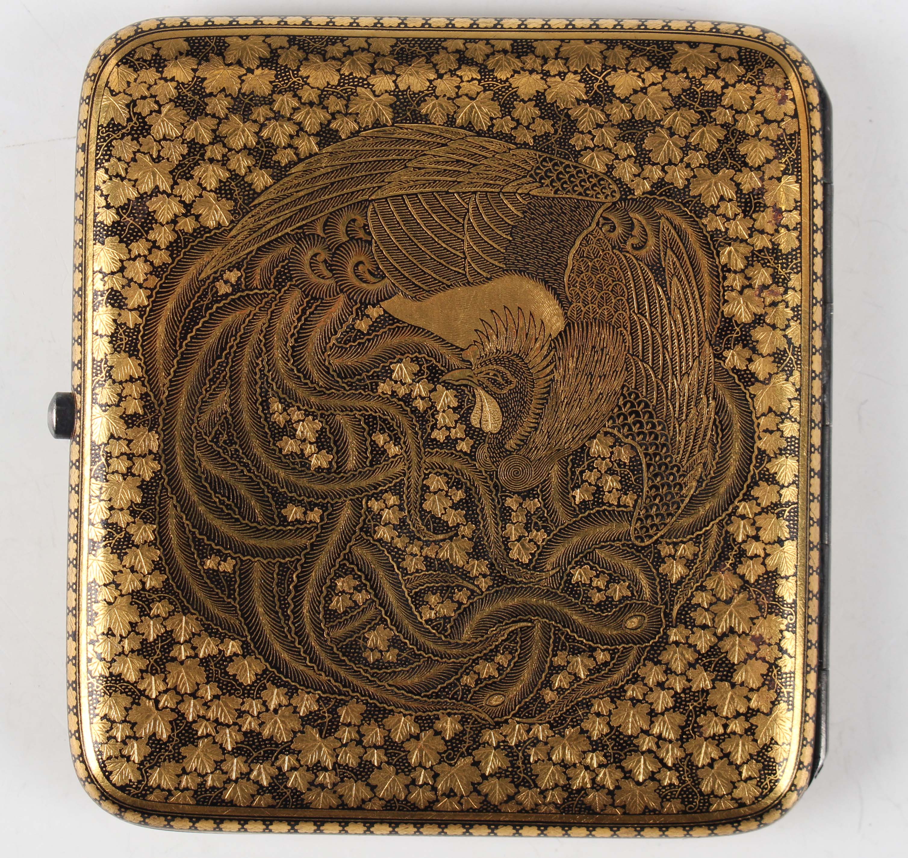 A Japanese Komai damascened iron cigarette case, early 20th century, of  curved rectangular form, one